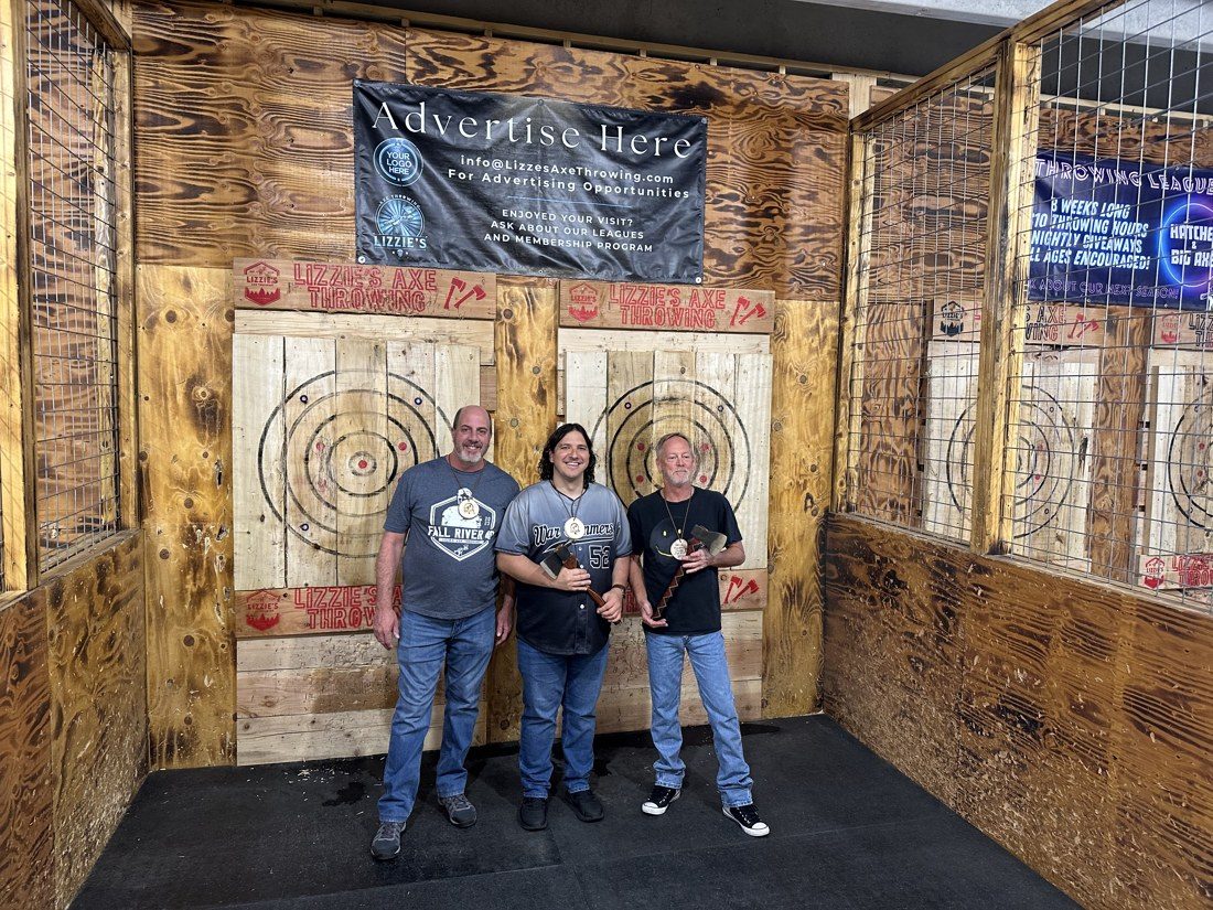 Scott Schell, left, Hammers and Dannenberg after the hatchet tournament. Schell is a co-owner of Lizzie's and competed in the field. Rico Vecchiarelli / AXEOLOGY